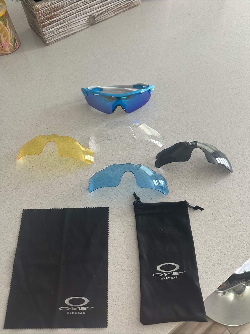 Oakley Blue Mirror Performance Sunglasses with Black Case and 4 extra lenses.